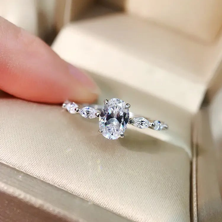 Oval Cut Moissanite Engagement Ring with Marquise Sides 18K Gold
